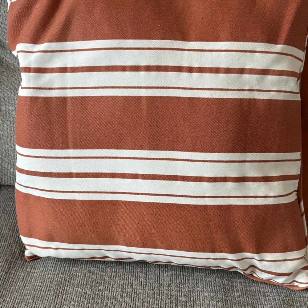 Orange and cream throw pillows